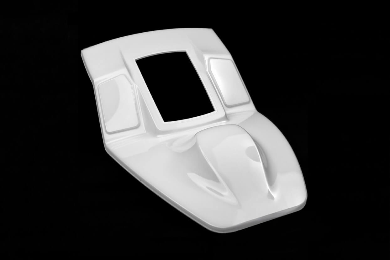 Effective protection, a high degree of gloss and impressive depth effect: PUR layer on the thermoplastic base support of a cockpit centre console